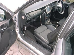 Fitting The Cables1.jpg - Most of the excess cabling went behind the glove box to and backwards down the side of the car and into the boot